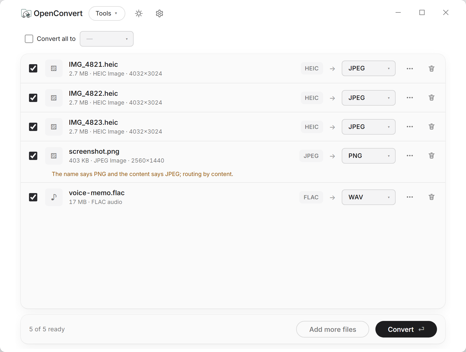 A batch of five files queued in OpenConvert, each with its own source format and target.